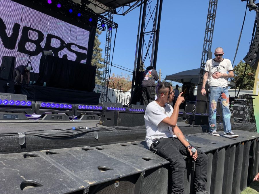 Sitting on the stage between songs, 99 Neighbors perform at the Bottlerock Music Festival 2021 in Napa, Calif.
