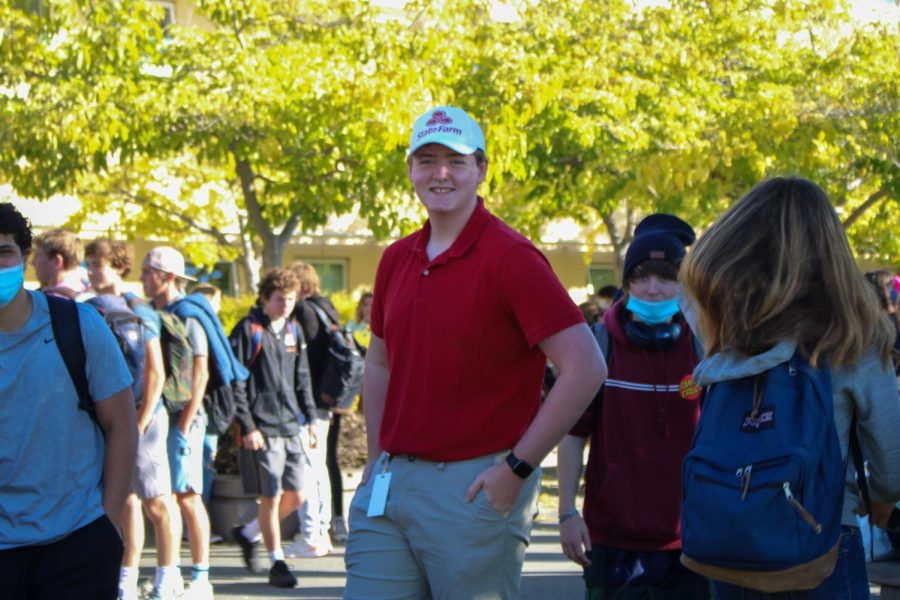 Dressing as Jake from State Farm, student Peter Dachtler prepares for Halloween.