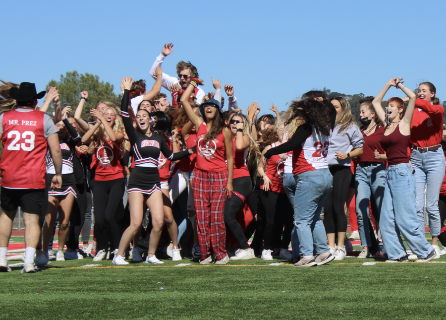 Ending their homecoming skit, the juniors jump with joy.