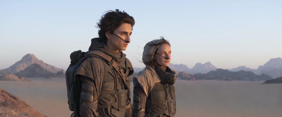  Trying to survive amongst the giant sandworms, Paul Atreides (Timothée Chalamet) and his mother Lady Jessica (Rebecca Ferguson) hike across the desert in search of the Fremen people. (photo courtesy of Warner Brothers)
