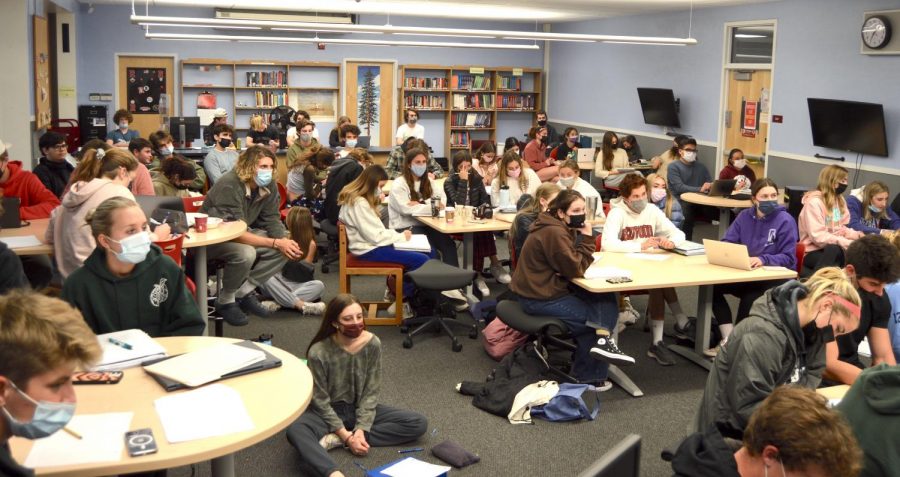 With finals around the corner, seniors pack the library to watch Stephen Harts lecture on Advanced Placement Economics during Cocoa and Cram.