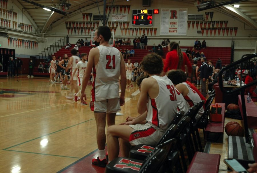 Watching intensely, Luc Poulin encourages his team in the second half of the MC Vs. Redwood varsity basketball game.