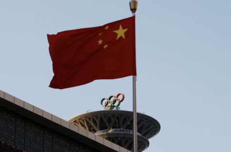 The Chinese flag flies outside of the Olympic Tower in Beijing, already prepared to host the Games in February. (Photo courtesy of Reuters/Carlos Garcia Rawlins)