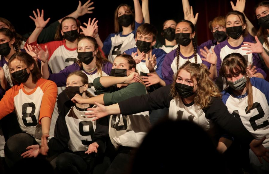 Gathered at the center of the stage, the cast of Micetro, a student improv comedy show at Redwood, celebrates the start of their show on Friday night, Feb. 11. 