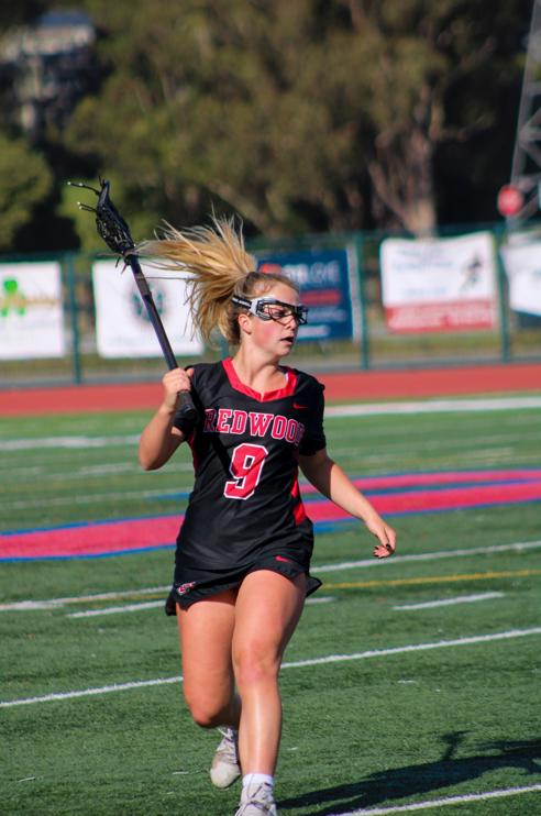 Coco McCulloch sprints into position at the Redwood v.s. Tam Lacrosse game 