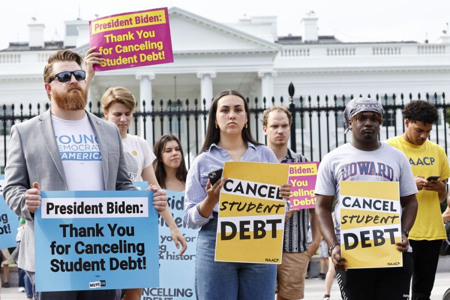 Taking to the streets, protesters advocate for debt cancellation in support of loan relief. 
