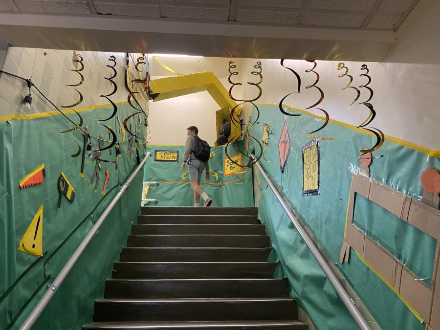 The Senior stairwell decorated in construction tape and streamers, representing the last fleeting moments of Homecoming week.