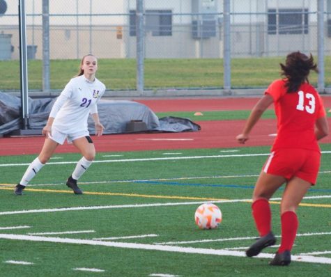 Caroline O’Donnell and Liliana De Leon Morales attempt to regain control of the ball to continue their offensive attack. 