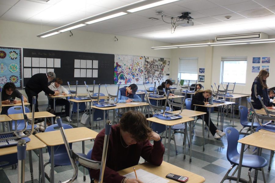 Focusing on their tests, students in room 258 make up tests on Monday morning that were missed in the week prior.
