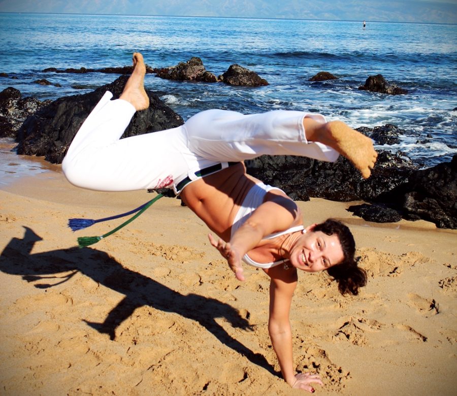 Kicking in the air, Lisa shows a capoeira movement in action. (Photo courtesy of Lisa Willoughby)
