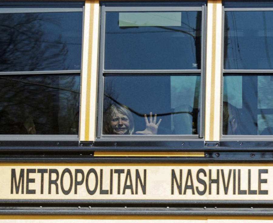 A child cries while leaving the bus from Covenant School on Monday afternoon. (Photo courtesy of Reuters)