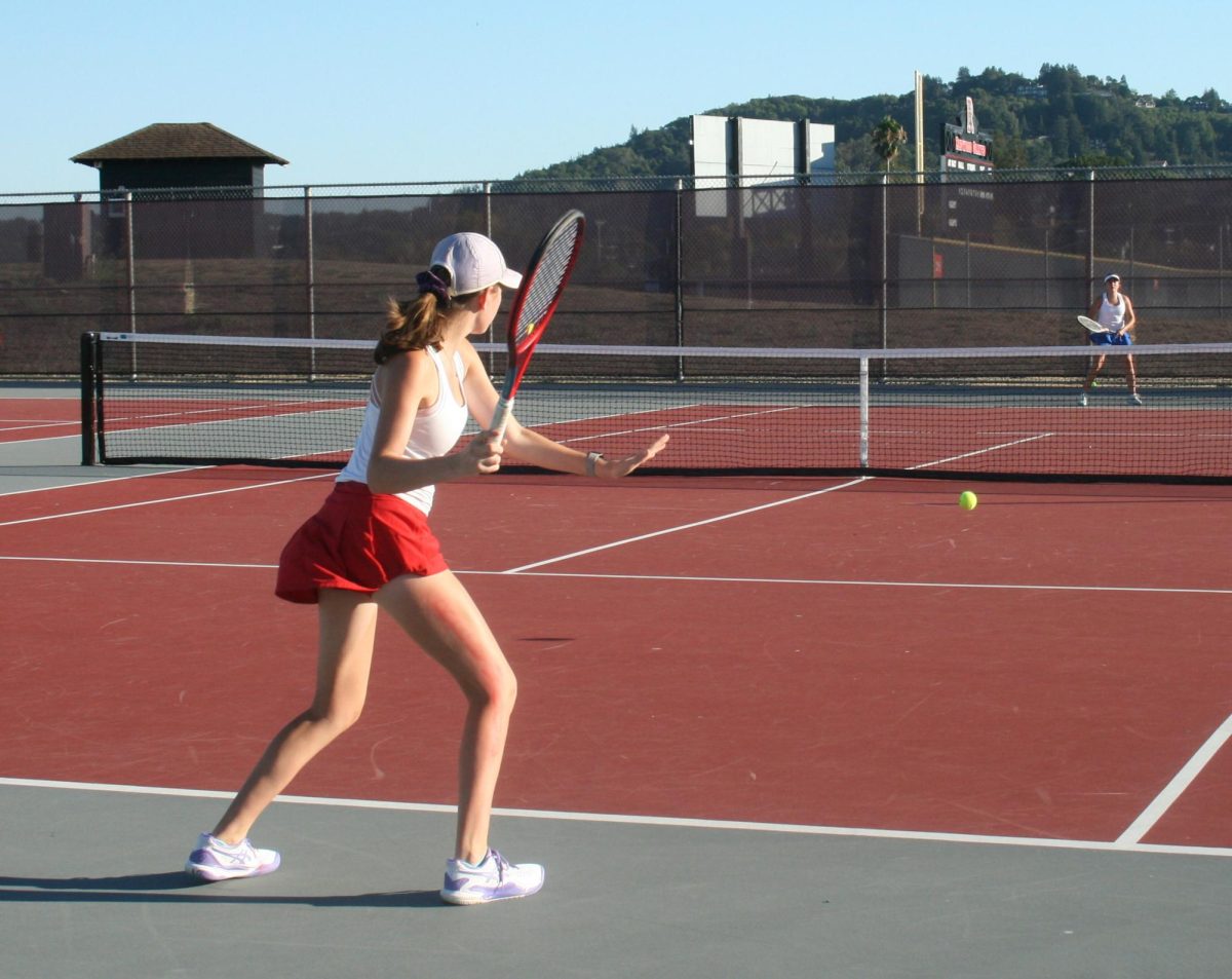 Getting ready to hit a strong forehand, junior Jordan Marotto prepares herself with an open stance.