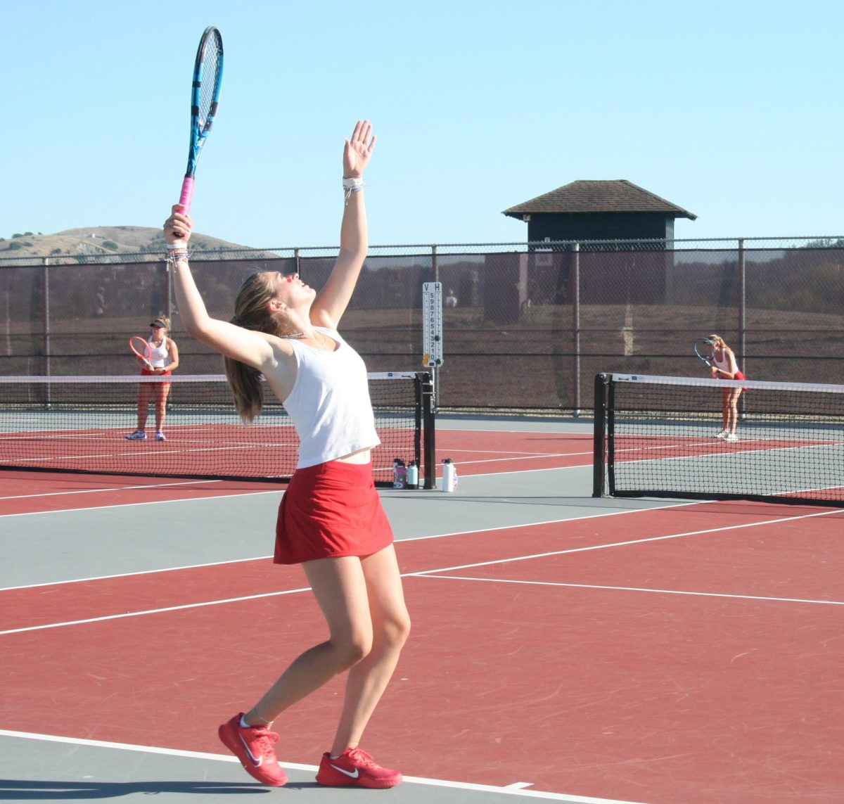 Serving with power, junior Julia Laury gets ready to smash the ball.