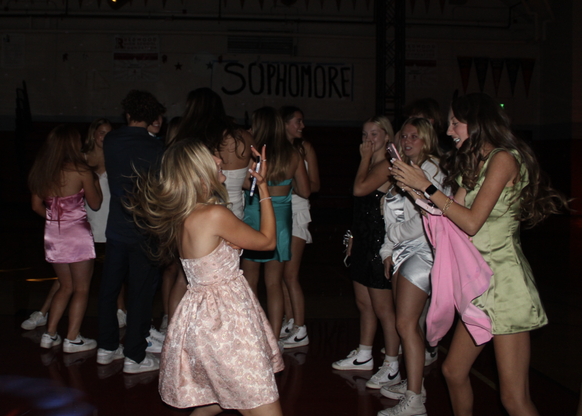 Senior Allie Douglas and sophomore Angelica Claire dance the night away.
