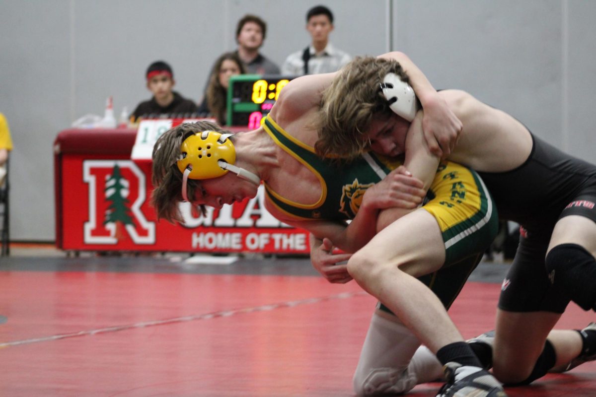 Using his strength, Dylan Mortin tries to bring his opponent to the mat, fighting for a pin. 
