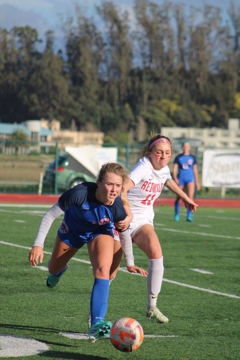 Junior Evelyn Spiegel chases after the ball.