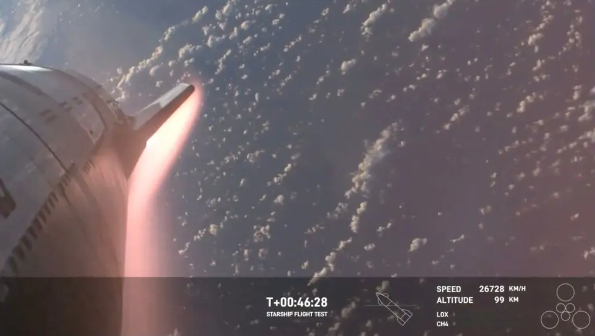 Starship is surrounded by a bright halo of hot red plasma on its re-entry into Earth’s atmosphere. (Image courtesy of SpaceX)