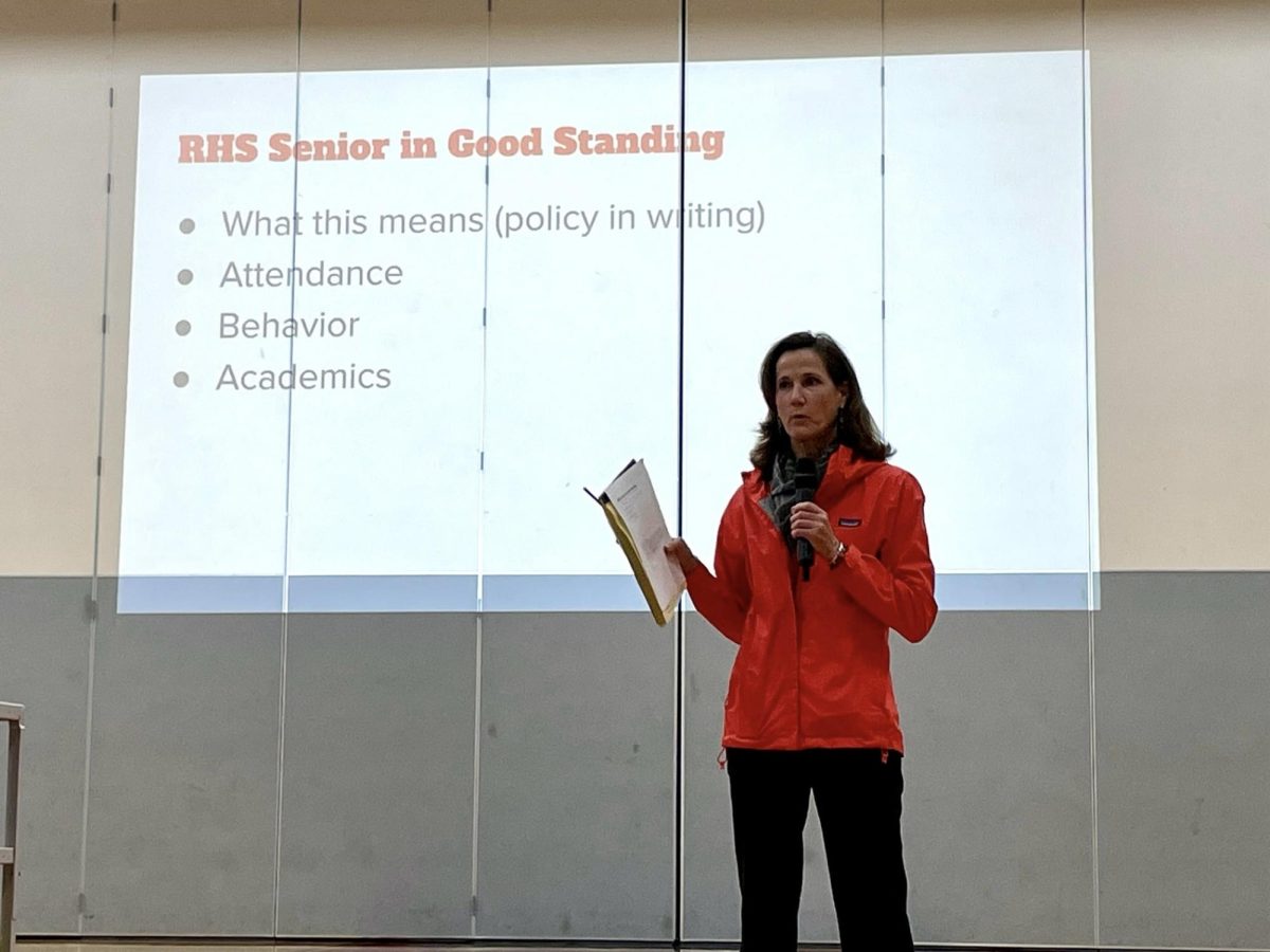 Addressing seniors, Assistant Principal Lisa Kemp explains attendance and other requirements for students to walk in the graduation ceremony.