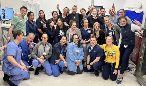 Doctors, nurses and technicians of the Marin Health Hospital laugh and entertain one another with silly faces (Photo courtesy of Dr. Grom).