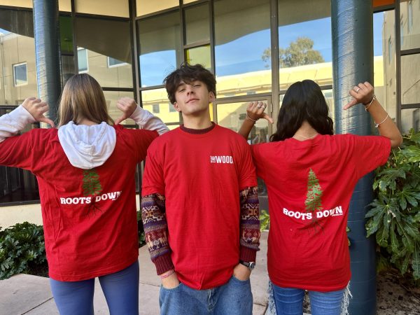  Decorated in customized apparel, members of The Woods flaunt their vibrant red t-shirts.
