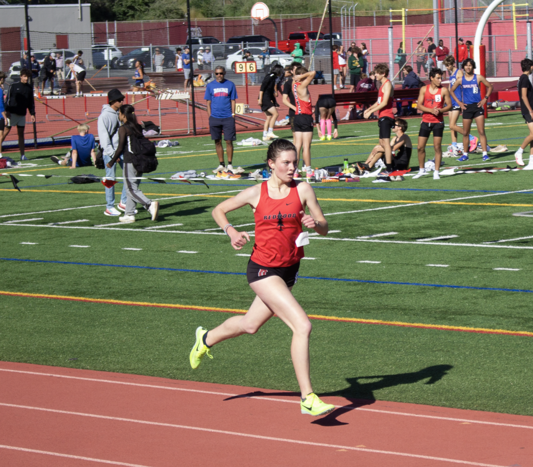 Racing to the finish line, junior Marley Nacco places first in her heat for the 1600 with a time of 5:21:06. 