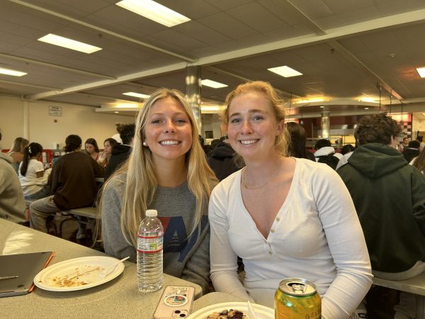 Riley Peterson and Caitlin Shaver eat together as they discuss what they will be doing at the graduation practice. 