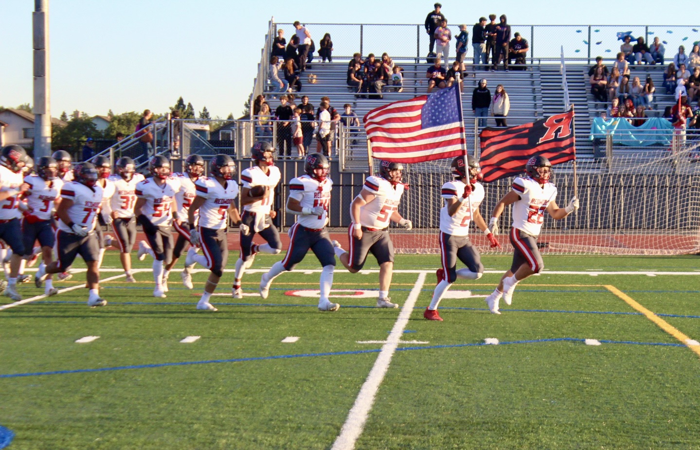 Senior captains Sean Cunneen and Ashlin Quach lead the Giants onto the field.