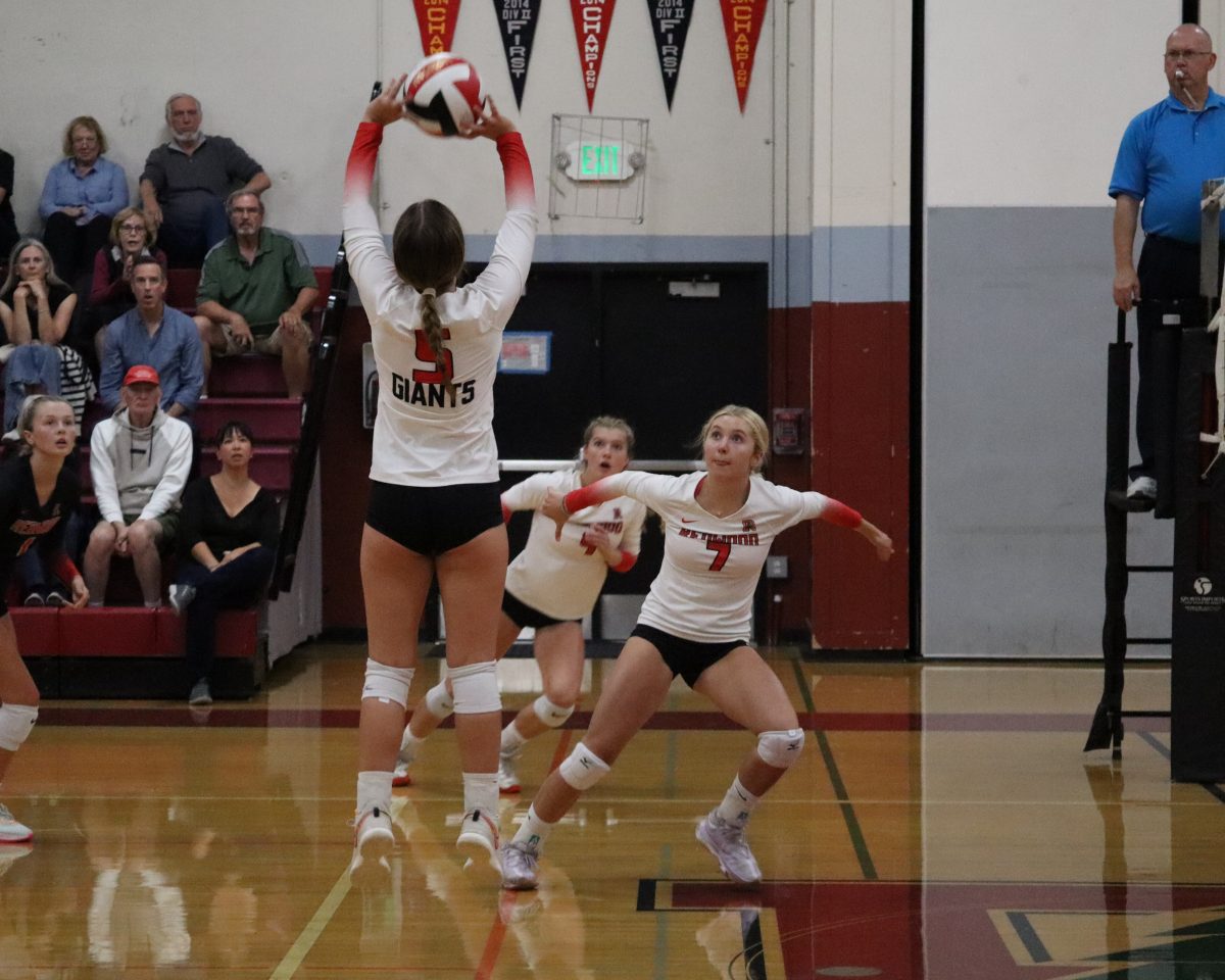 Setting the ball, sophomore Katie Lazzareschi passes it to her teammates