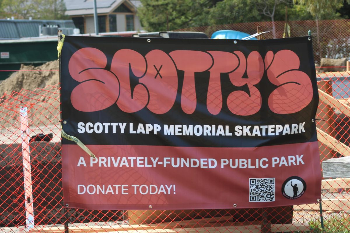 Scotty Lapp Memorial Skatepark sign displayed at the construction sight. 
