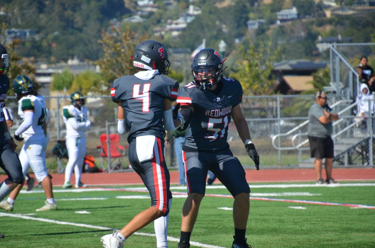 After a strong run by junior, Dylan McGrath (4), he celebrates with junior Alexander Teodoro (51)