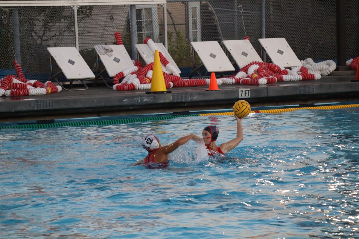 Jordan Maurus throws the ball to a teammate over a Terra Linda player.