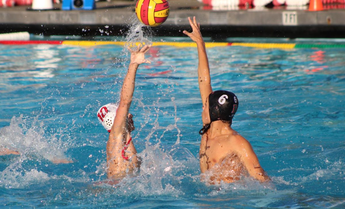 Senior Lukas Knauer reaches for the ball, blocking San Rafael's pass. (Nico Ruel)