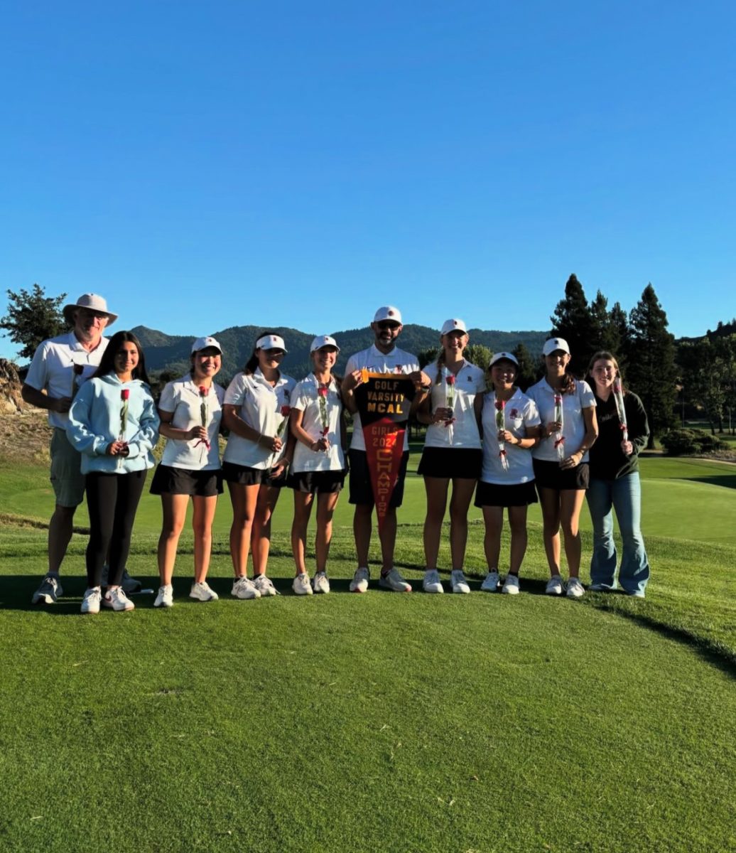 Excited after another tournament win, the girls' golf takes a team picture in their uniform. (Photo courtesy of girls' varsity golf Instagram)
