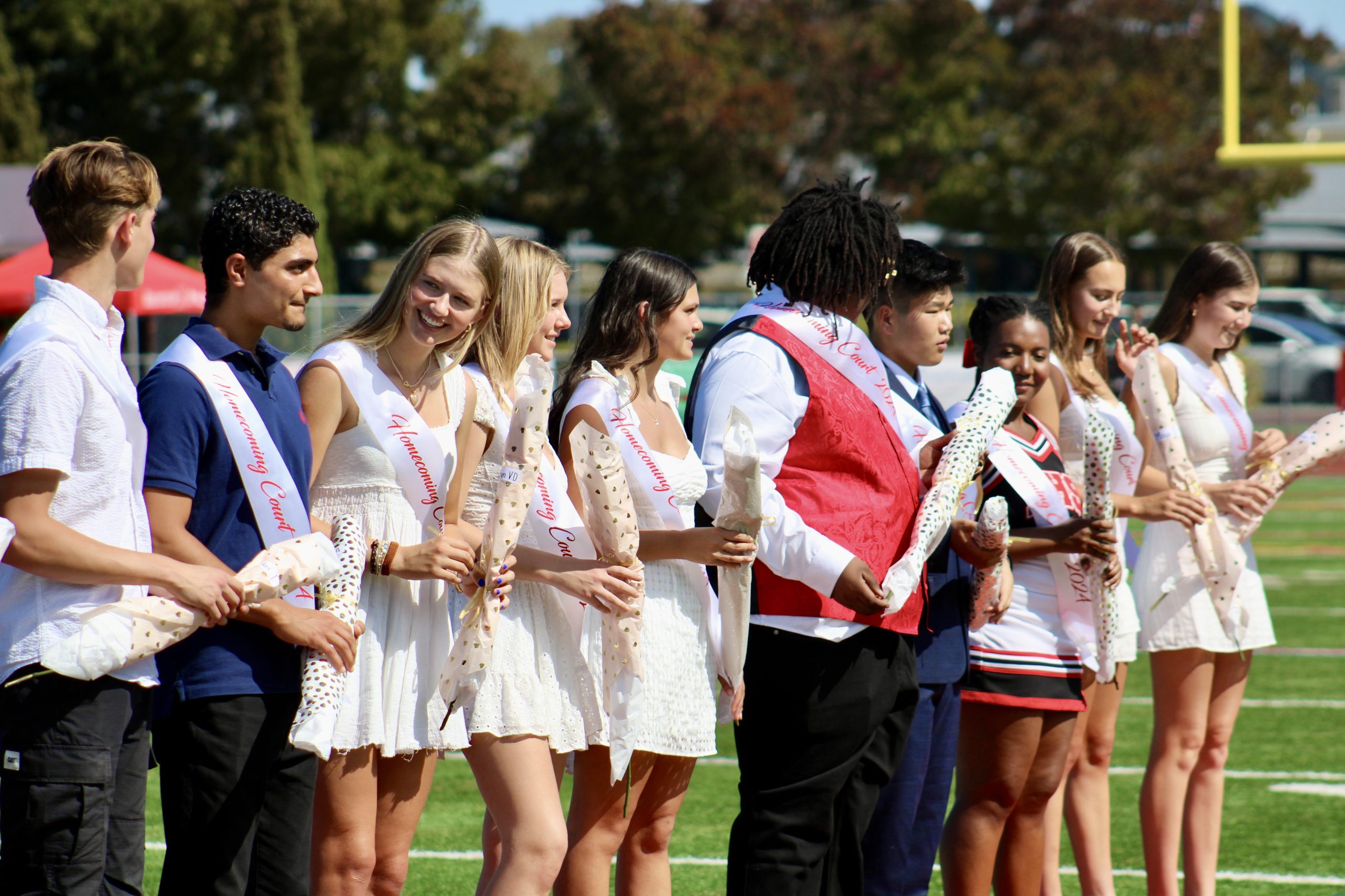 Each member of the Homecoming court receives a rose. Senior Elon Harris was crowned as the "royalty" and received a white rose. 