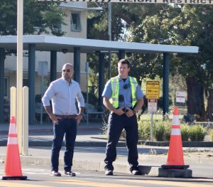 Turning students away from campus, Assistant Principal Saum Zargar and a police officer stand outside the front parking lot. (Photo courtesy of Hilah Brekhus-Lavinsky)