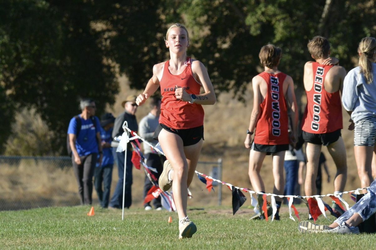 Freshman Riley Buck finishes the race with the last push to the end. (Image Courtesy of Alex Kosorukov)
