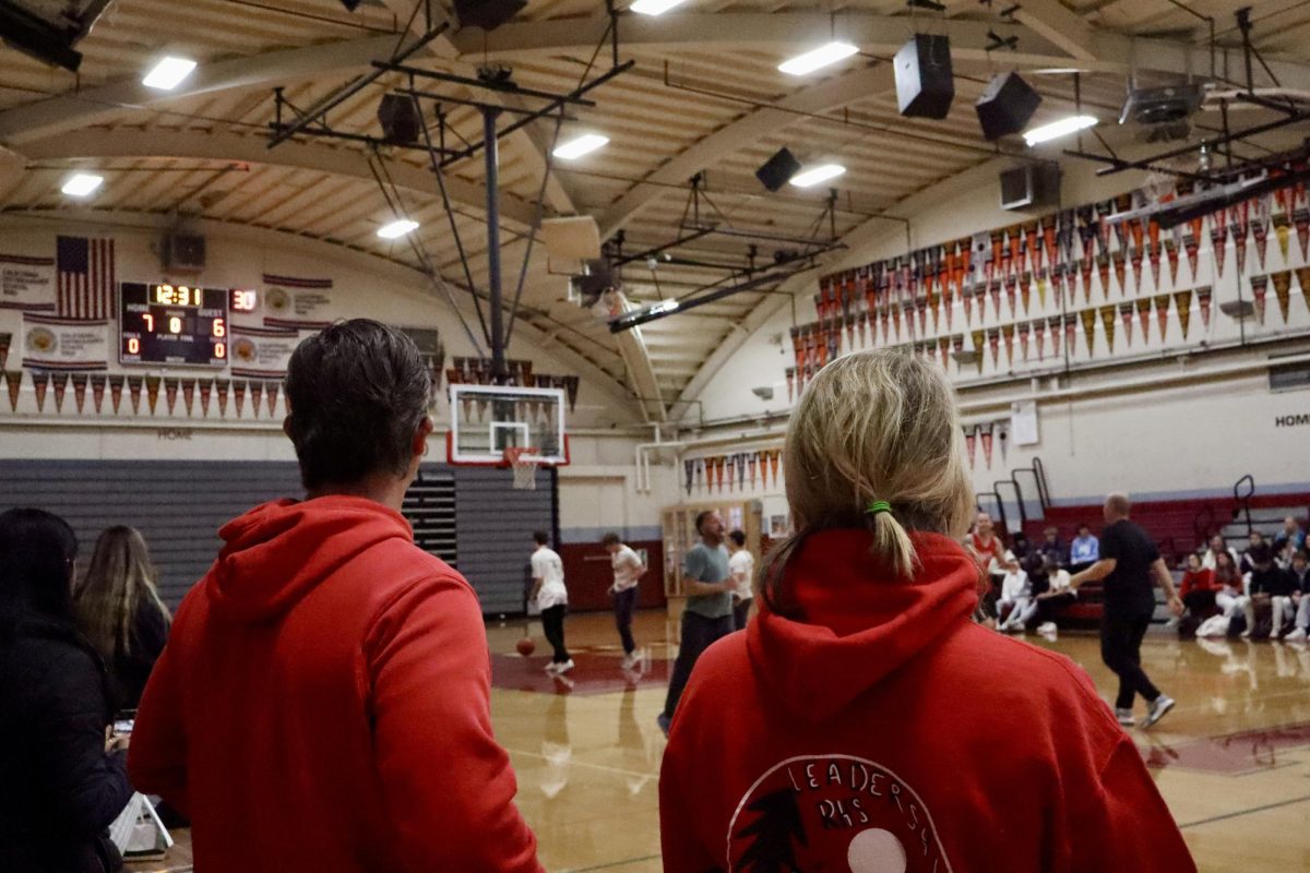 Teachers David Plescia and Christy Silkworth marvel over the game.