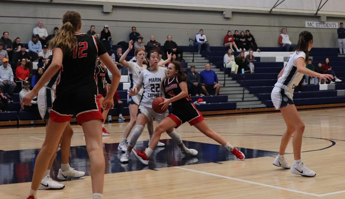 Senior Maya Saibel makes her way through the defense to take a shot.