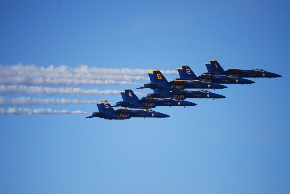 Overhead the San Francisco Bay, the Blue Angels fly mere feet apart in their world-famous Delta Wing formation.