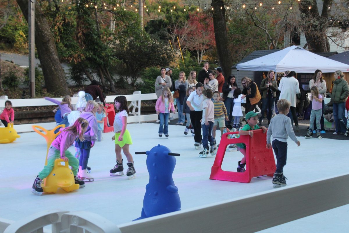 Gliding on the ice, kids enjoy the eco-friendly skating rink.
