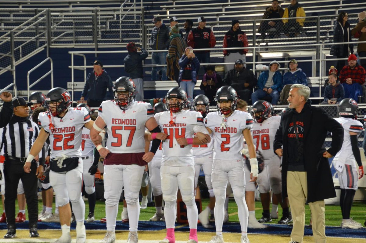 From the left, senior captains Sean Cuneen, Jack McKemey, Miles Harrison and Ashlin Quach interlock arms.