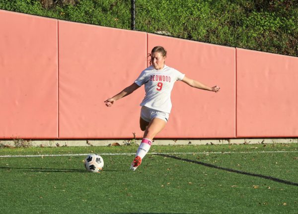 Senior captain Tessa Marshall winds up to kick the ball downfield towards her teammates. 