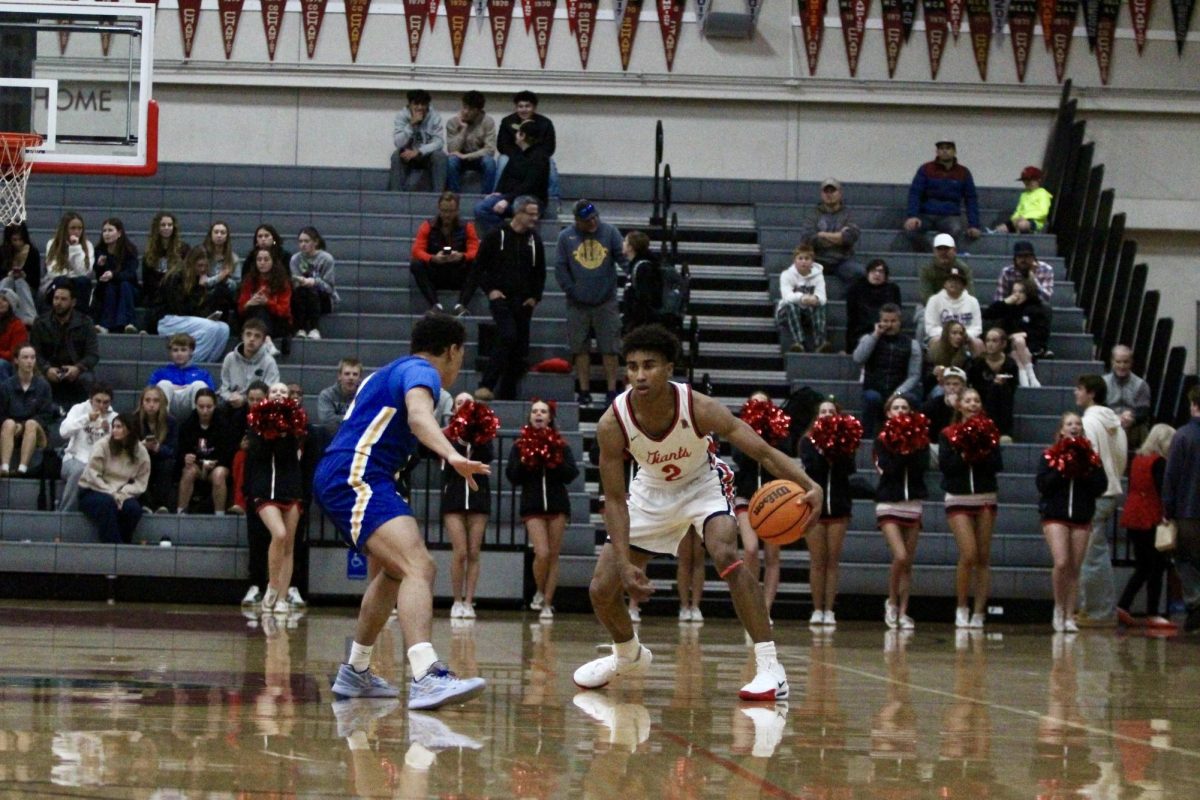 Semetri “TT” Carr sizes up his defender, dribbling skillfully to create a scoring opportunity for the Giants. 
