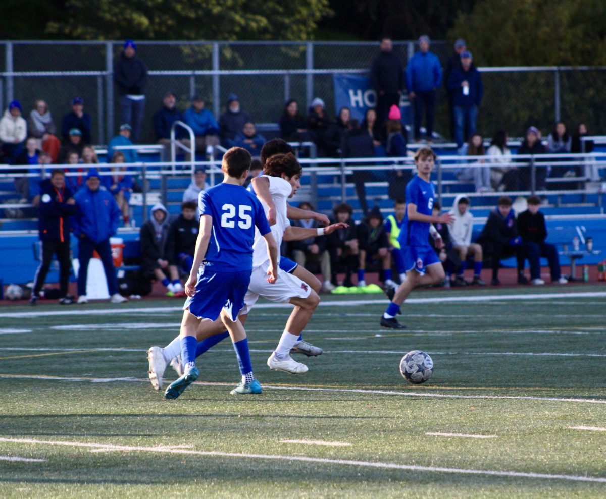 Kamran Madani steals the ball from the Hawks and runs it down the field.
