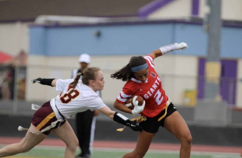 Dodging her opponent, junior Riya Pyle sprints away from pressure.

