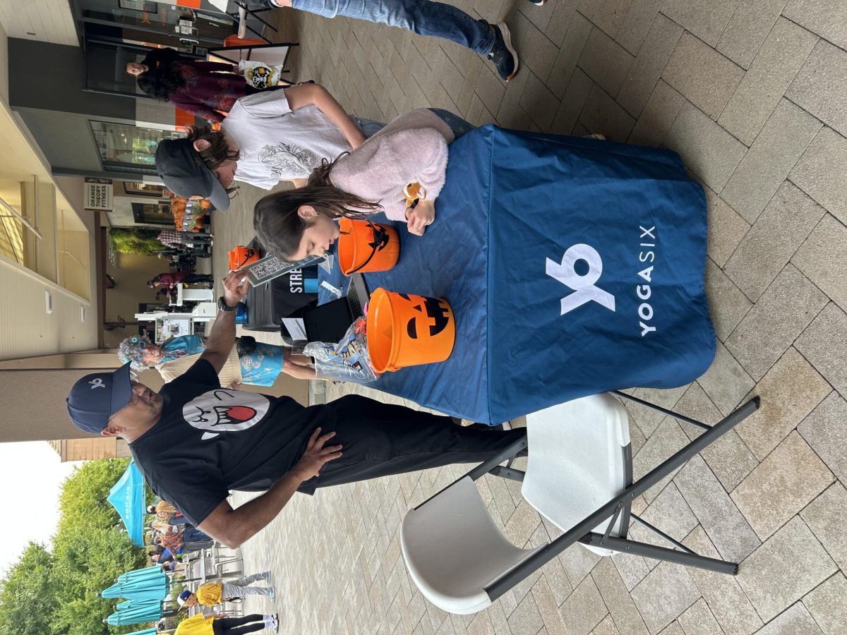Shafiq Ferrer, owner of YogaSix Greenbrae, passed out candy to kids at Bon Air's Halloween Event.