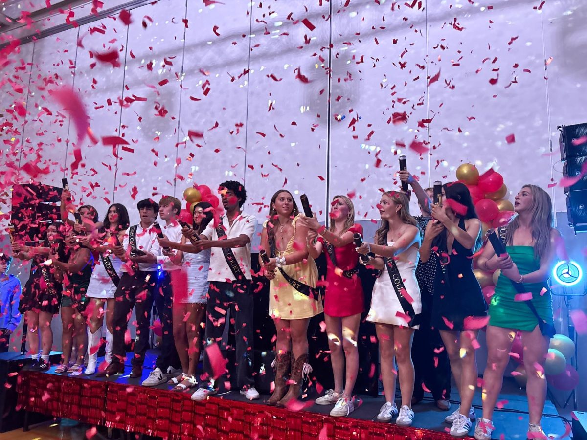 Raining confetti, the Homecoming Court celebrated as the winner was revealed by gold confetti. Charlotte “Cat” Domet (far left) took the crown for 2025.