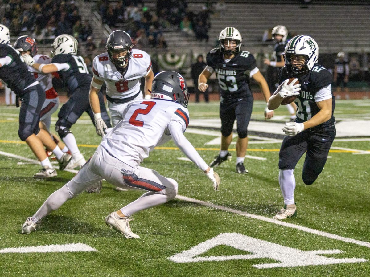 Diving for the rusher, senior cornerback Rudy Vasquez stretches out to stop the Matadors' gain.