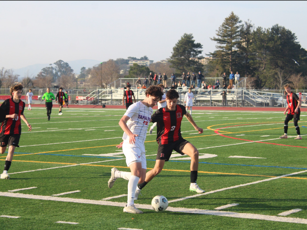 Sophomore left back Ellis Jones sticks to his defender, preventing another shot on goal.
