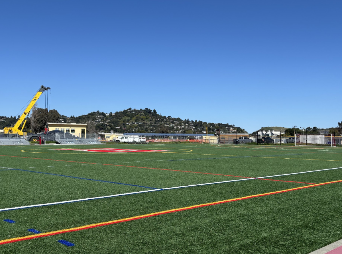 Construction on the new music buildings has resulted in only one softball field for both varsity and junior varsity (JV) to use, making it harder to reschedule games after weather cancellations. 